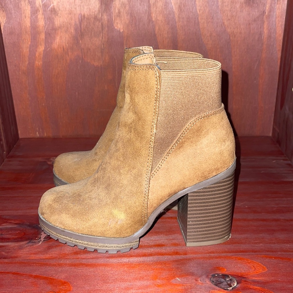 These are brown ankle boots. Suede Almost new